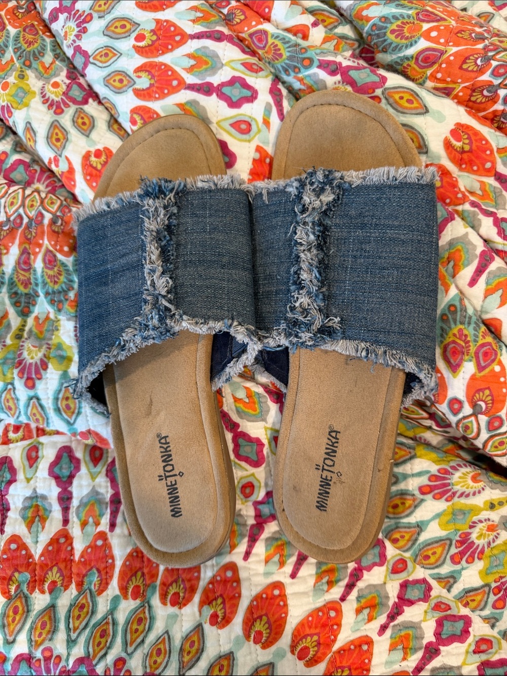 Minnetonka Denim Frayed Slide Mules in Blue and Tan